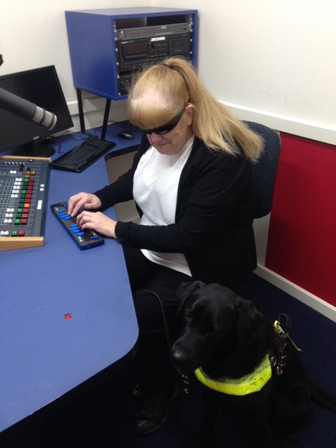 Vicki in the studio with Bella using her new Focus Blue 40 braille reader
