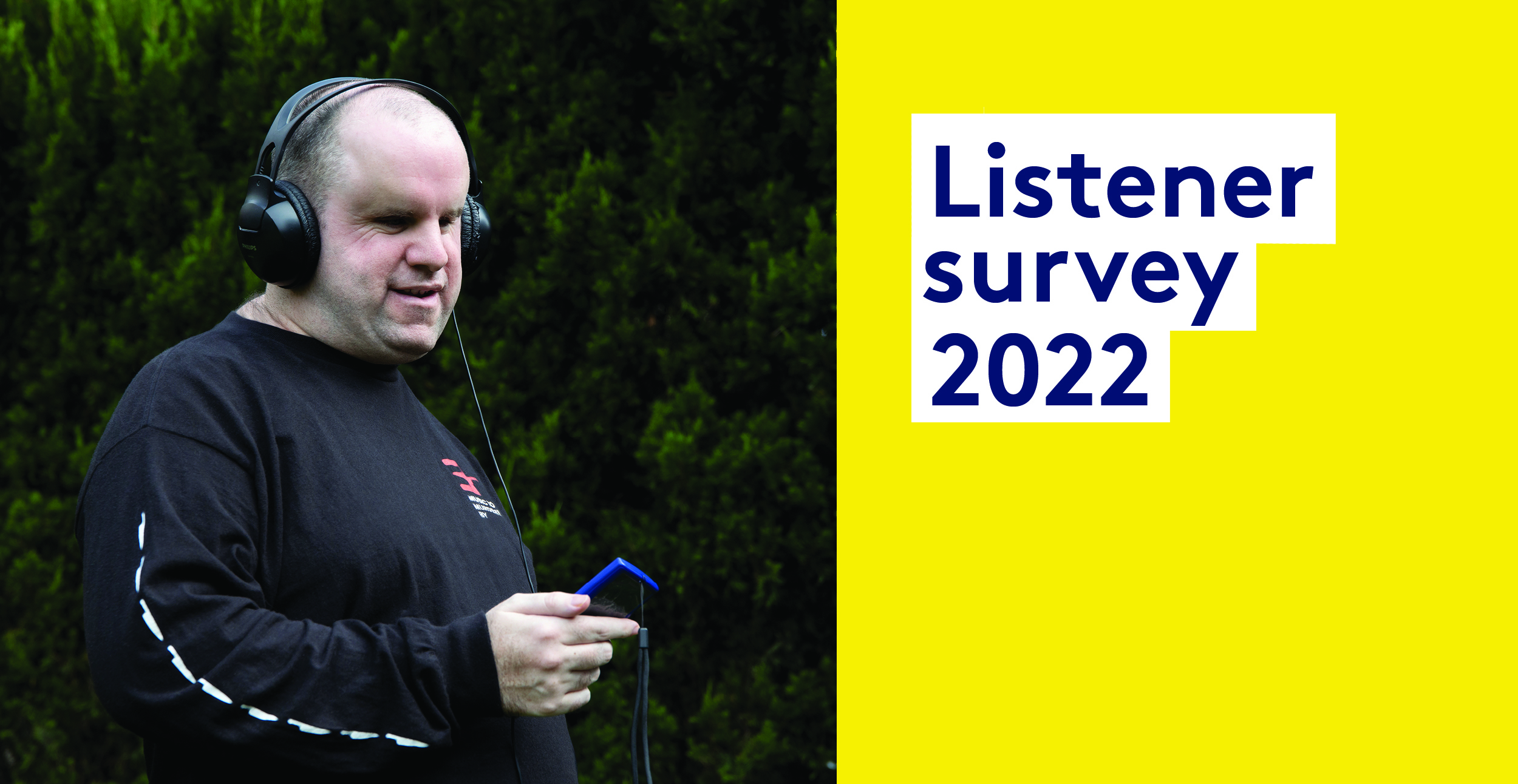 Listener survey 2022. Man wearing headphones and listening from a portable device
