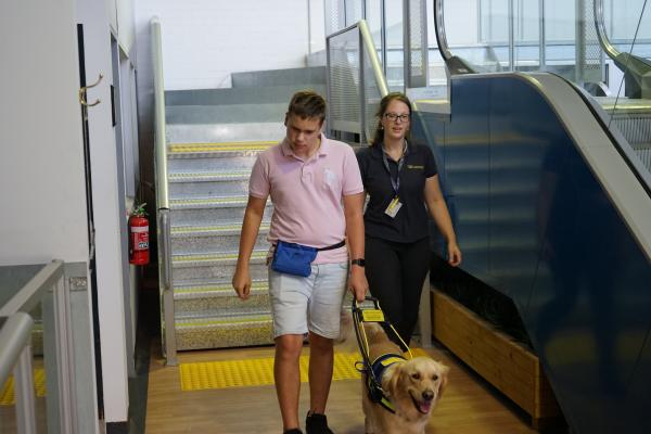 Ollie Fanshawe with Seeing Eye Dogs trainer Brooke Anderson and Ollie's Seeing Eye Dog Sadie