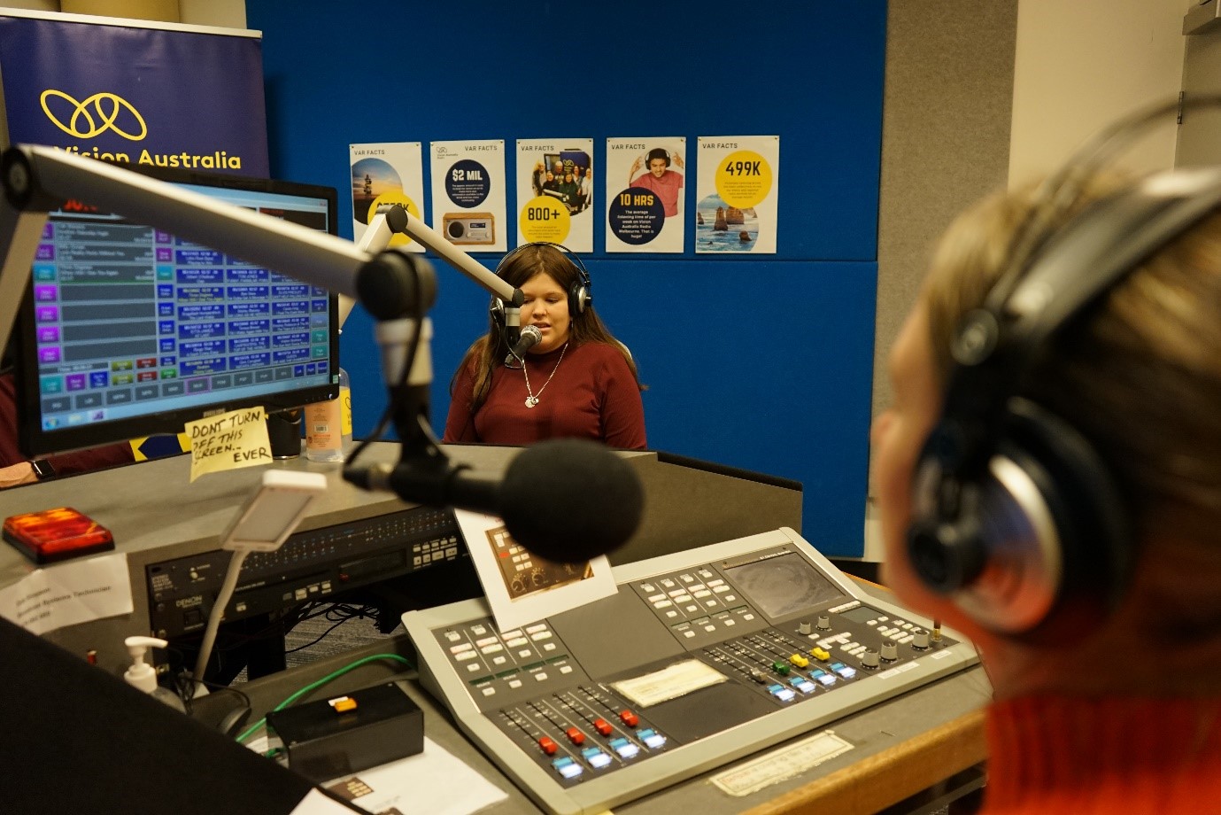 Behind the scenes, podcast presenters of Vision Australia's Nothing's Off Limits podcast in the radio studio