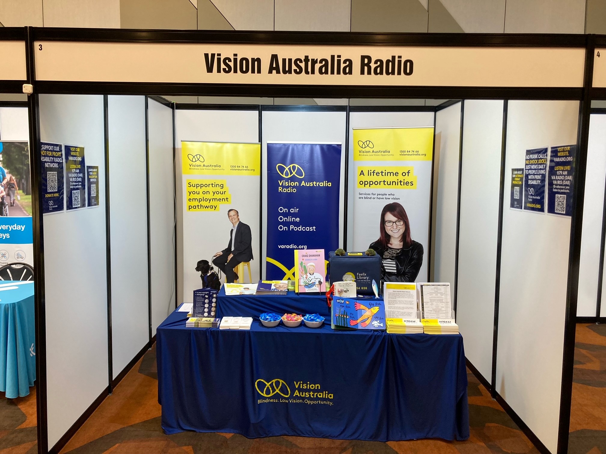 Photo: A front view of the Vision Australia Radio stall at the Impact 2024 Conference.