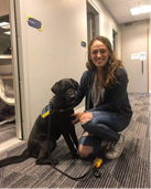 Seeing Eye Dogs Show presenter Harriet Moffat with a Seeing Eye Dog in harness just outside Vision Australia Radio studios