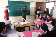 Photo is Ellen volunteering at a school for deaf and blind children in India.