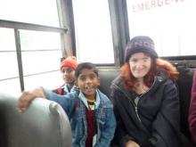 Ellen on bus with young students Ellen on bus with young students